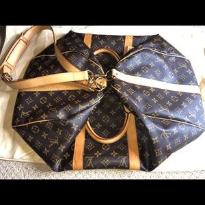 Louis Vuitton duffle bag with straps & luggage tag